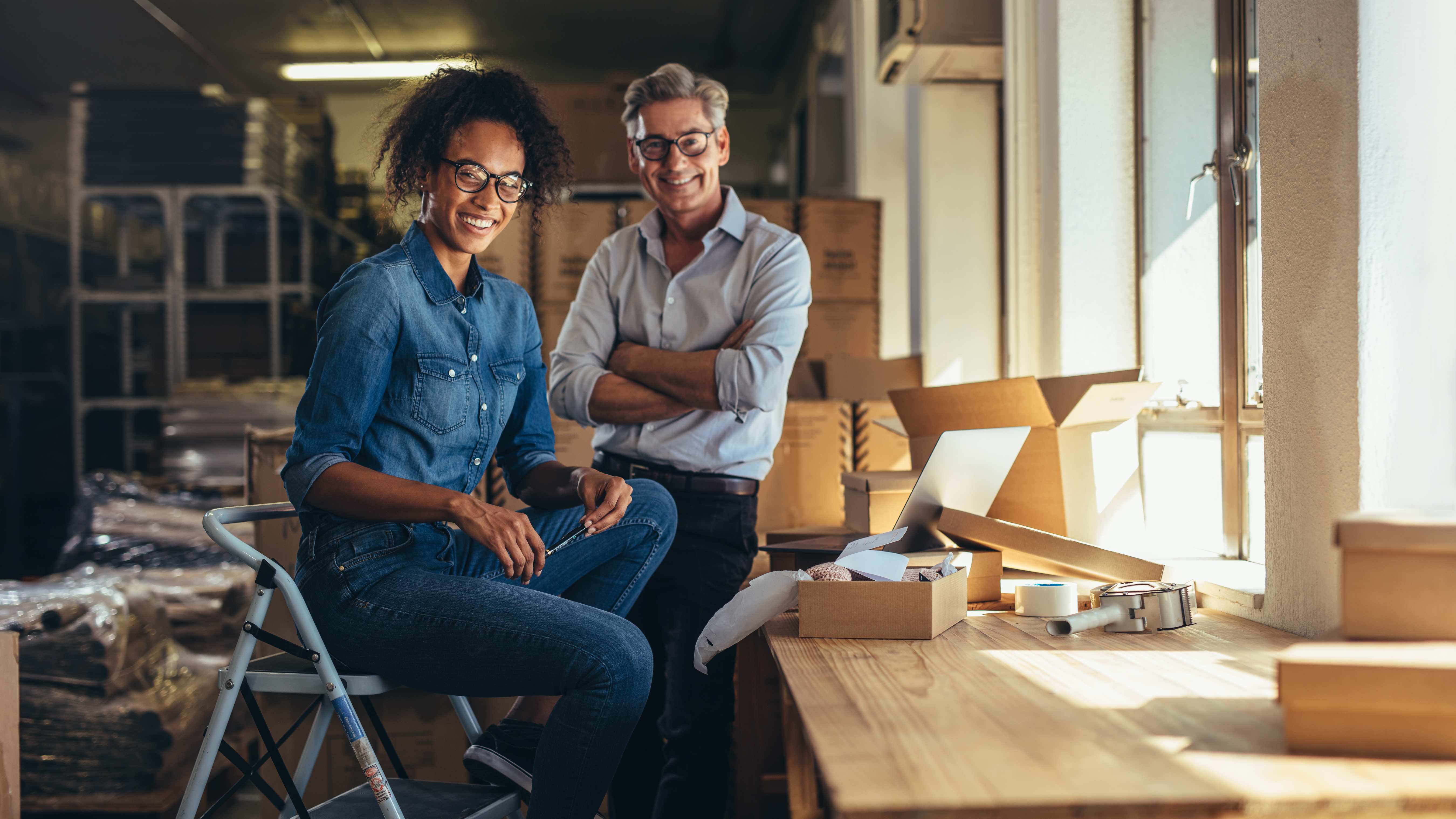 happy-man-and-woman-in-business